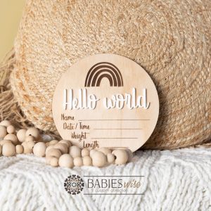 Round timber birth announcement plaque with engraved rainbow design, 3D "Hello World" script and spaces for baby's name, date, time, weight and length.