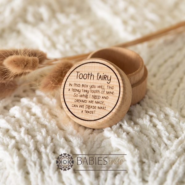 Timber tooth fairy box with UV printed "Tooth Fairy Box" message and circular border on the lid. Styled with a soft blanket and Bunny Tails Grass.