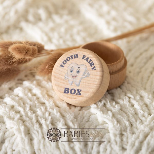 Timber tooth fairy box with UV printed tooth chaacter and blue "Tooth Fairy Box" text. Styled with a soft blanket and Bunny Tails Grass.