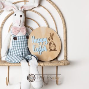 Happy Easter round timber plaque with laser engraved floral bunny and 3D acrylic "Happy Easter" lettering. Styled with a soft toy bunny on a wicker chair.
