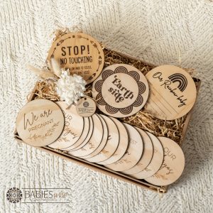 IVF rainbow baby gift box with timber milestone discs , birth announcement plaque, No Touching pram plaque, Earthsise Plaque. Set in a gift box with dried flowers. Gift Box is styled on a soft blanket.