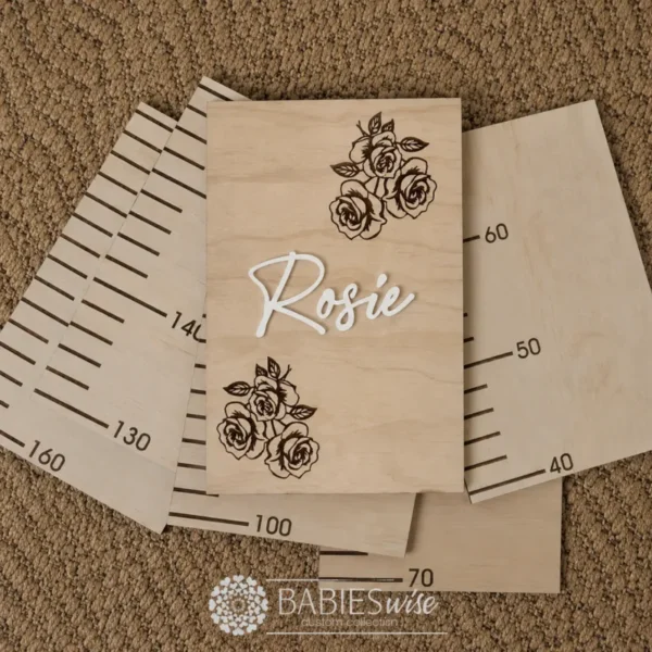 Personalised timber Rose growth chart featuring laser-engraved racing cars and a raised 3D acrylic name.